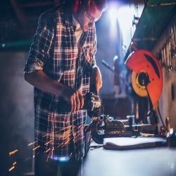 Technician testing Bosch drill at Delhi Power Tools workshop